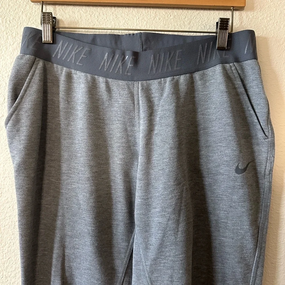 Nike women's Dark Gray Athletic Joggers with Black Waistband size L/ NWOT B187